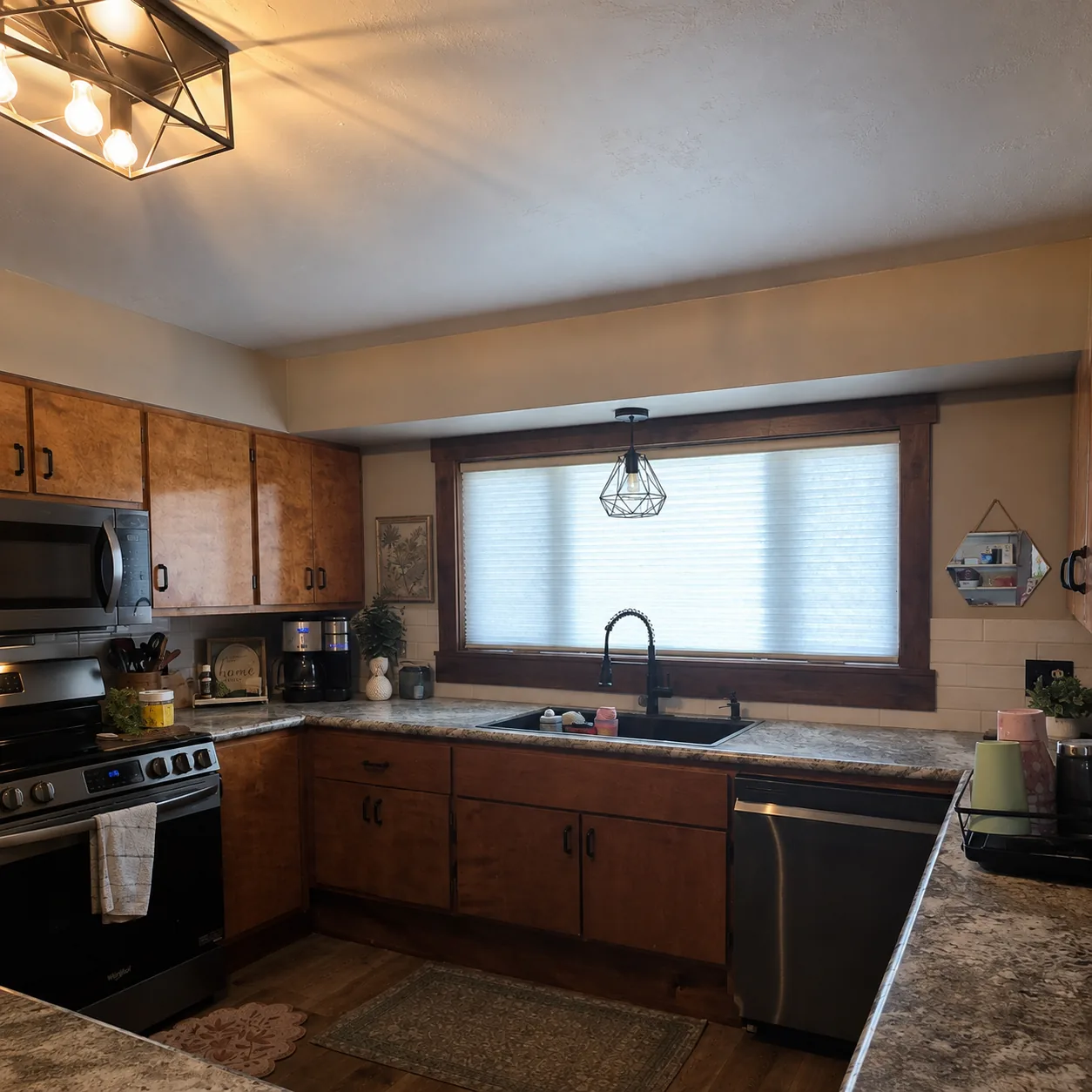 White cellular shade above a kitchen sink